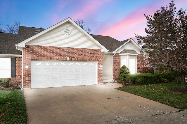 view of front of property with a garage