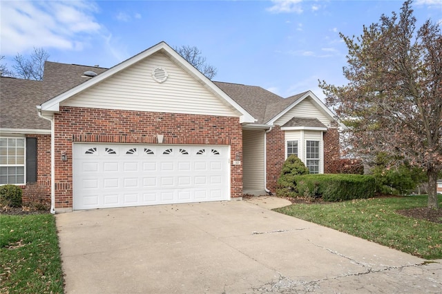 view of front of house featuring a garage and a front lawn