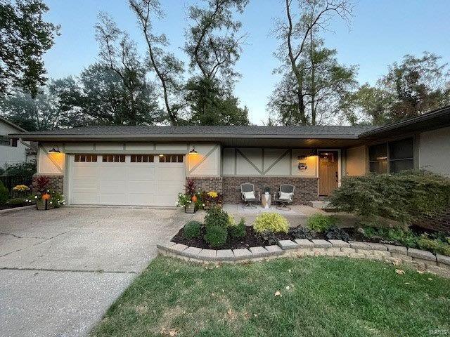 single story home with a garage