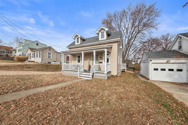 view of front of property with covered porch, an outdoor structure, and a garage