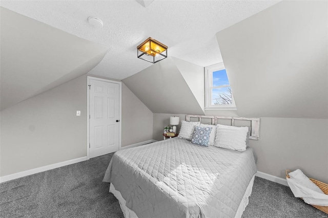 bedroom featuring carpet flooring, a textured ceiling, and vaulted ceiling