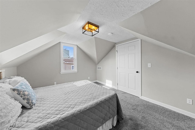 bedroom featuring carpet flooring, a textured ceiling, and lofted ceiling