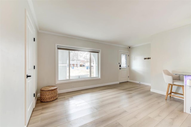 foyer featuring light hardwood / wood-style floors and ornamental molding