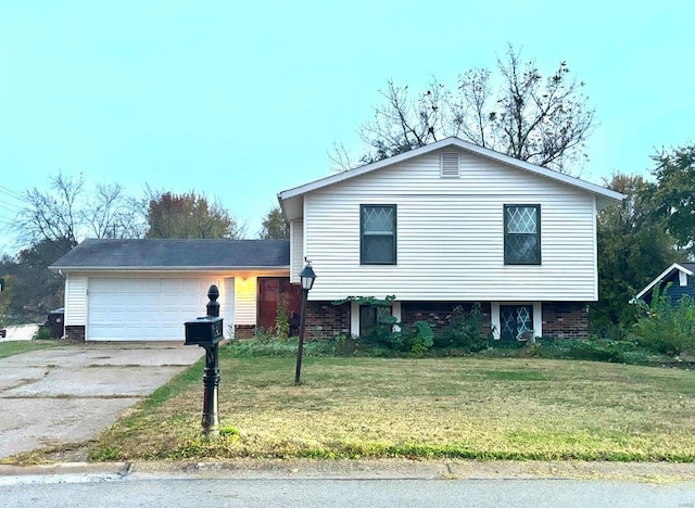 view of front facade with a garage and a front lawn