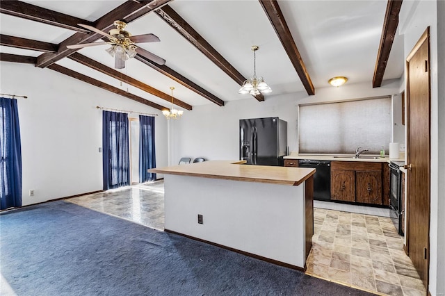 kitchen with sink, lofted ceiling with beams, pendant lighting, a kitchen island with sink, and black appliances