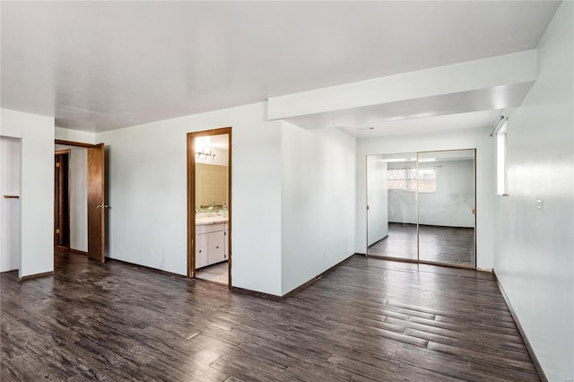 unfurnished room featuring dark hardwood / wood-style floors