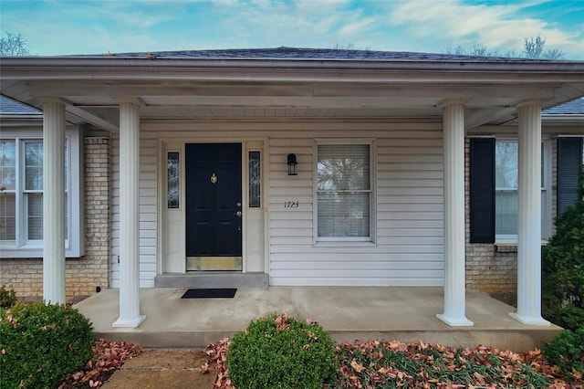 doorway to property with a porch