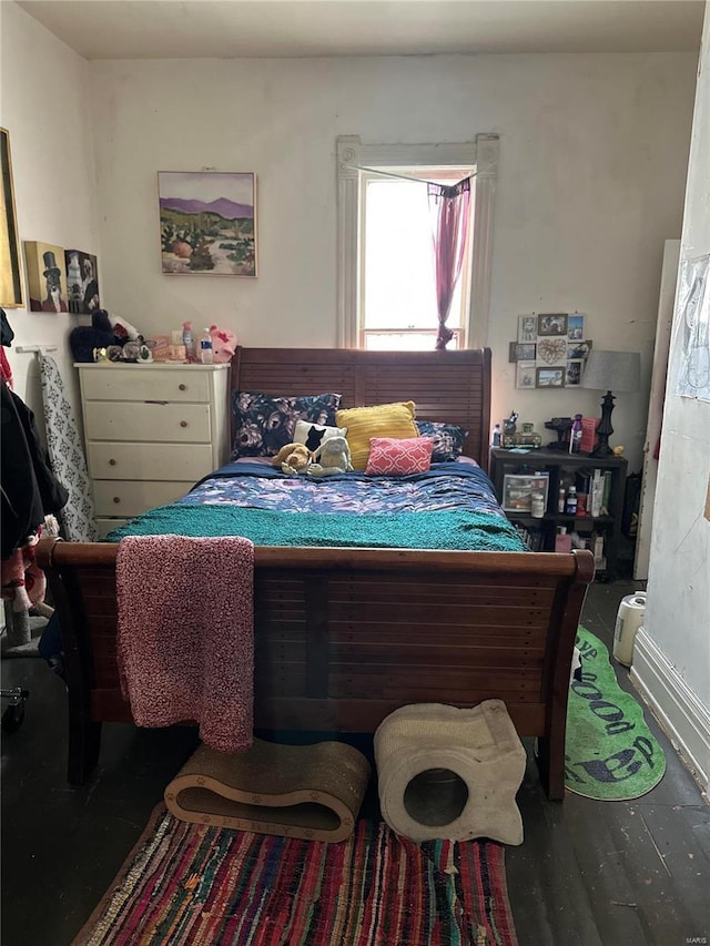 bedroom with wood-type flooring