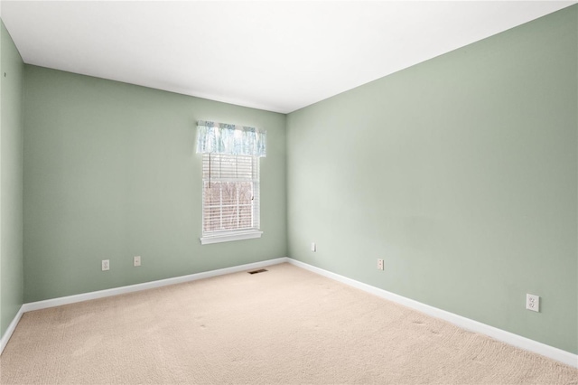 unfurnished room with carpet floors