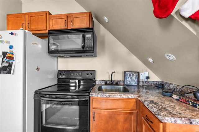 kitchen with black appliances, dark stone countertops, sink, and vaulted ceiling