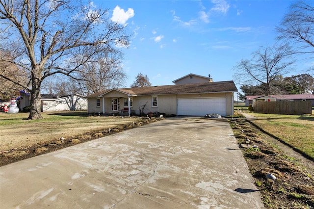 ranch-style home with a garage and a front yard