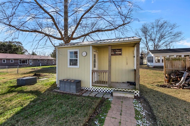 view of outbuilding featuring a yard