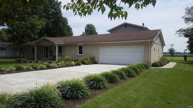 ranch-style home featuring a front lawn and a garage