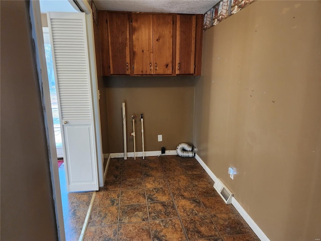 laundry room with cabinets