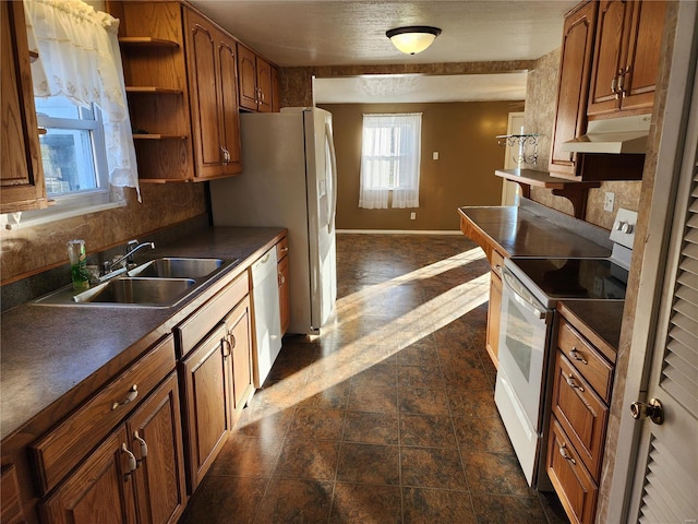 kitchen with tasteful backsplash, sink, and white appliances