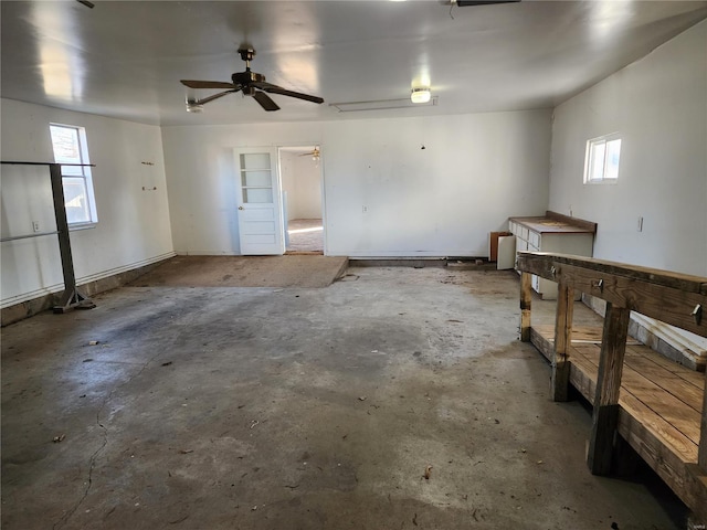 interior space with ceiling fan and plenty of natural light