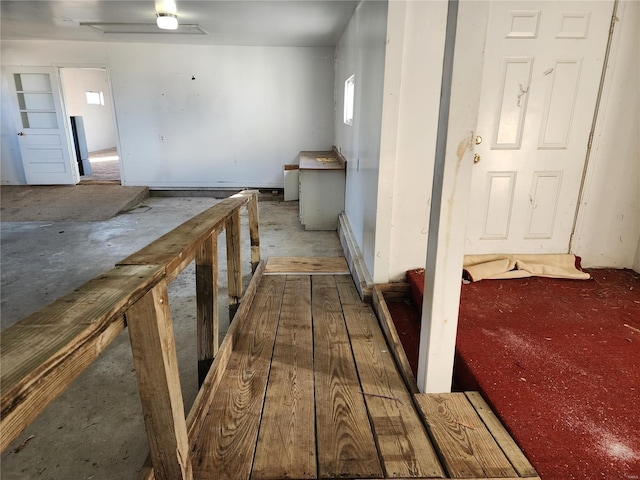 hall featuring concrete flooring