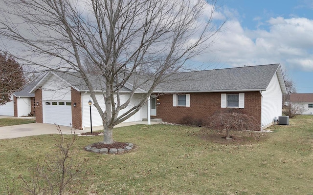 ranch-style home featuring a garage, central air condition unit, and a front yard