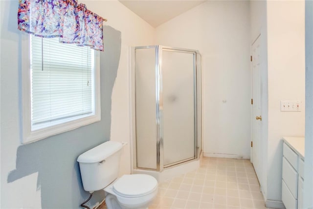 bathroom featuring vanity, toilet, an enclosed shower, and vaulted ceiling