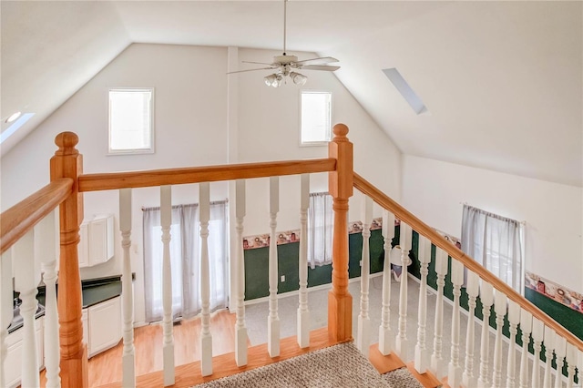 bonus room featuring ceiling fan, a healthy amount of sunlight, and lofted ceiling