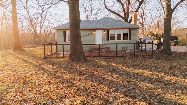 view of side of home featuring a lawn