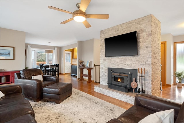 living room with hardwood / wood-style flooring and ceiling fan