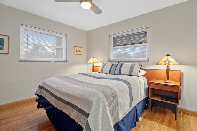 bedroom featuring hardwood / wood-style floors and ceiling fan