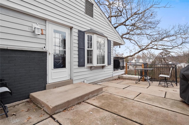 doorway to property featuring a patio area