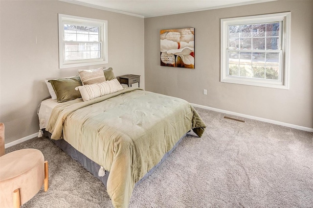 carpeted bedroom featuring crown molding