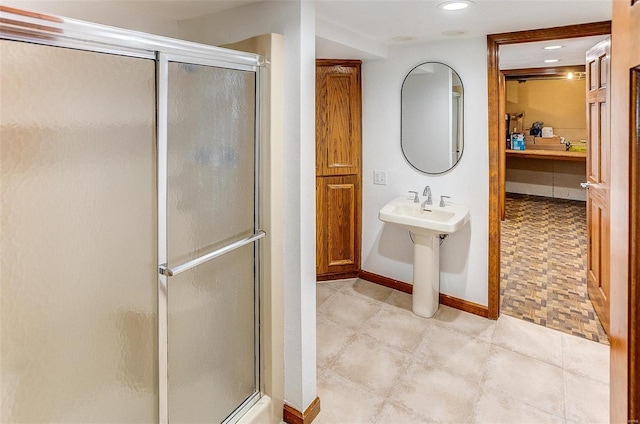 bathroom featuring an enclosed shower