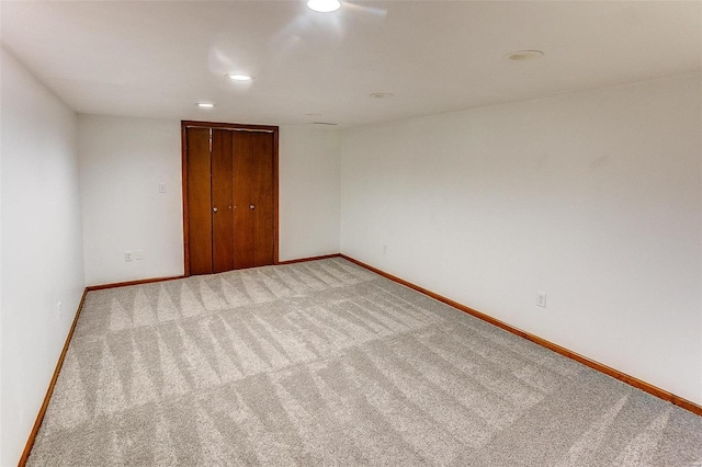 unfurnished room featuring carpet