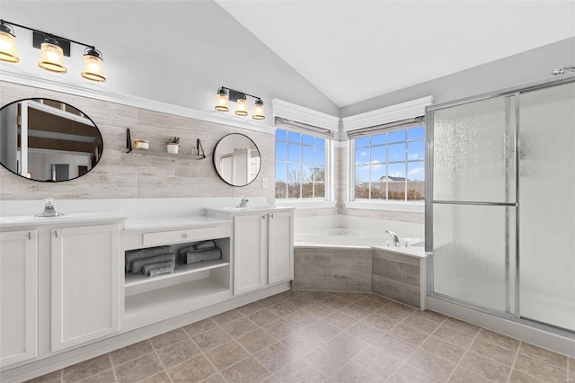 bathroom featuring tile patterned flooring, vanity, separate shower and tub, and lofted ceiling