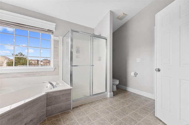 bathroom featuring separate shower and tub and toilet