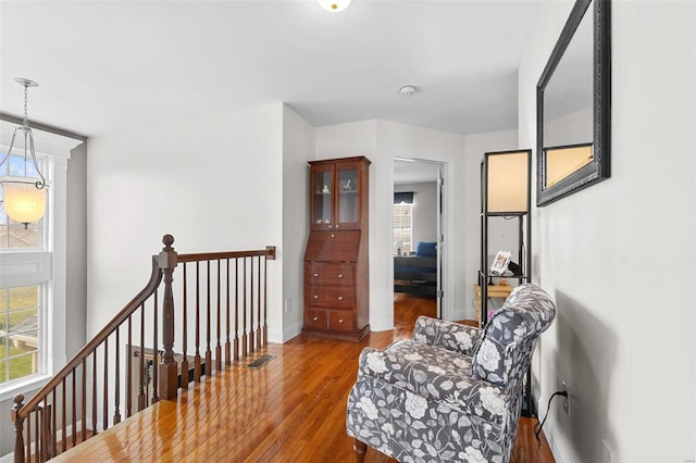 living area with hardwood / wood-style flooring