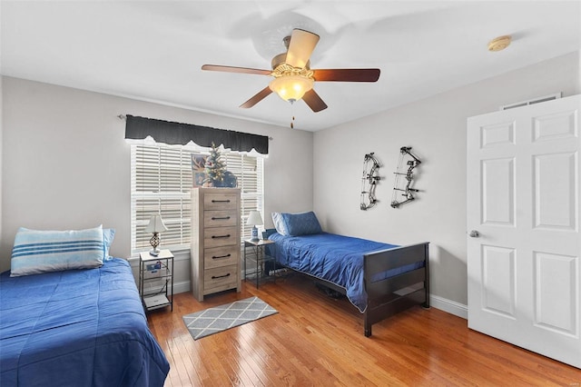 bedroom featuring ceiling fan and hardwood / wood-style flooring