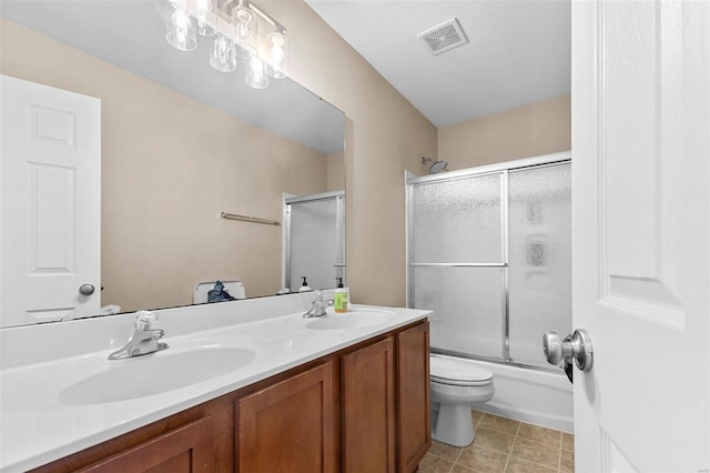 full bathroom featuring vanity, toilet, and enclosed tub / shower combo