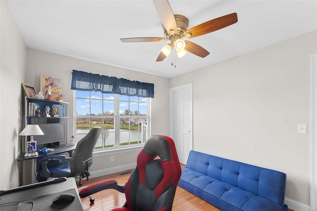 office area with hardwood / wood-style flooring and ceiling fan