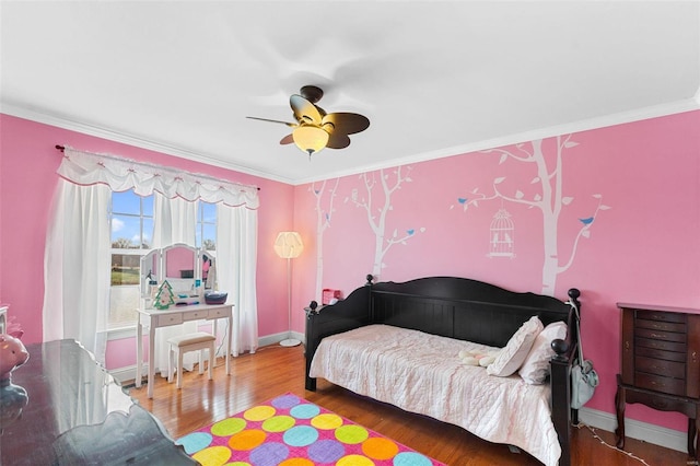 bedroom featuring crown molding, ceiling fan, and wood-type flooring