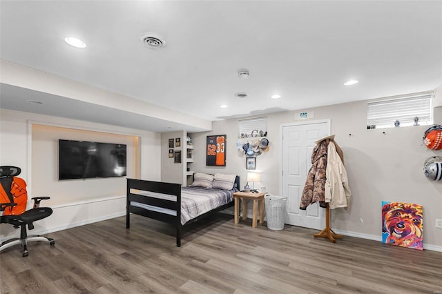 bedroom with hardwood / wood-style floors