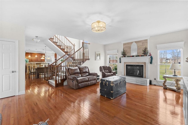 living room with hardwood / wood-style floors and a fireplace