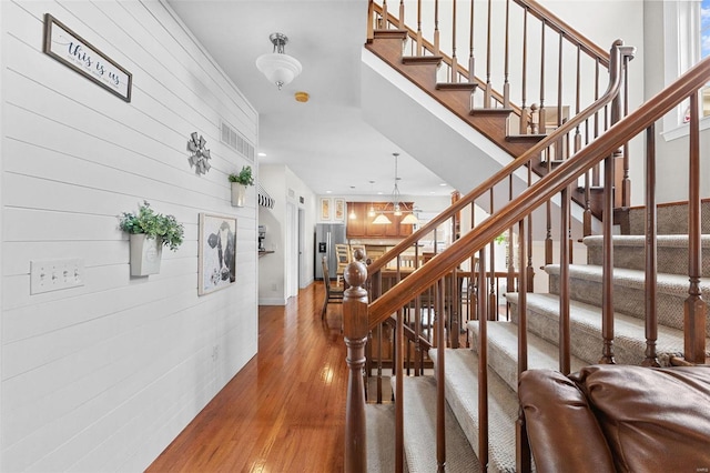 staircase featuring hardwood / wood-style flooring