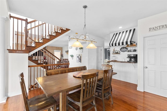 dining room with hardwood / wood-style flooring