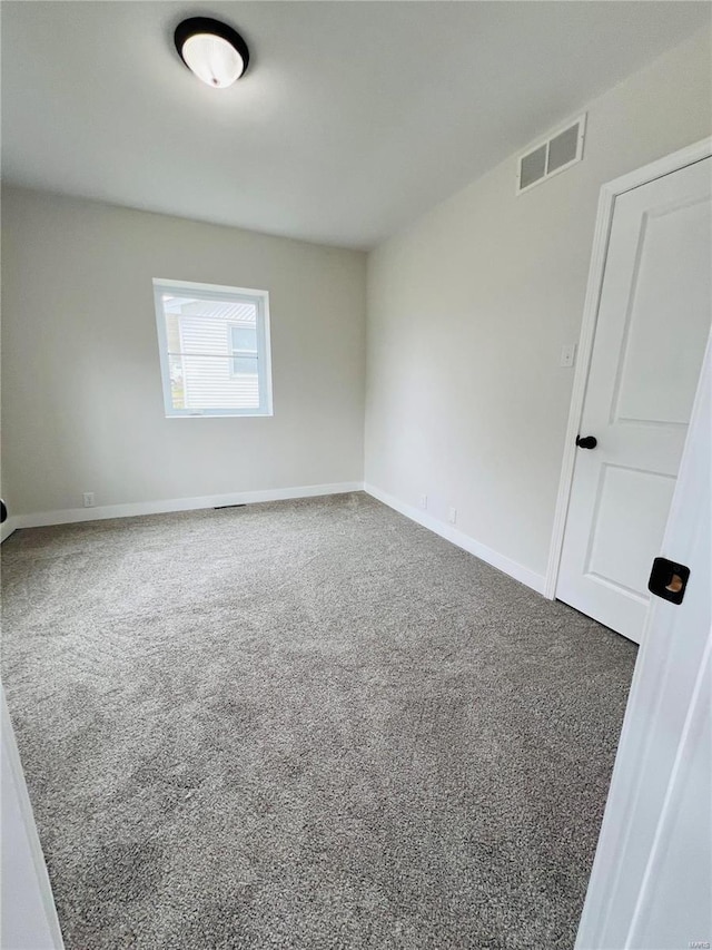 view of carpeted spare room