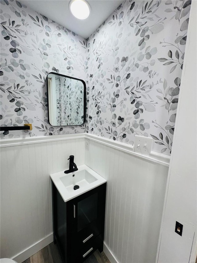 bathroom with vanity and hardwood / wood-style flooring