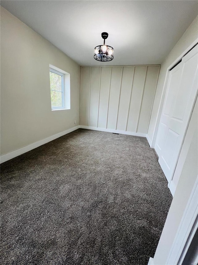 unfurnished dining area featuring carpet