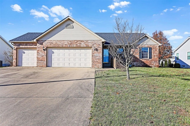 view of front of property with a front yard and a garage