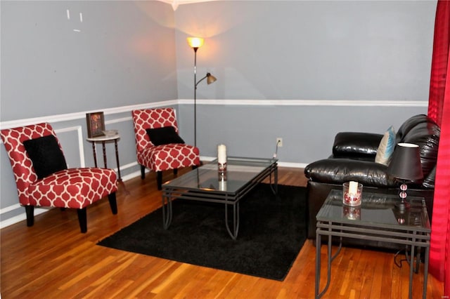 sitting room with hardwood / wood-style flooring