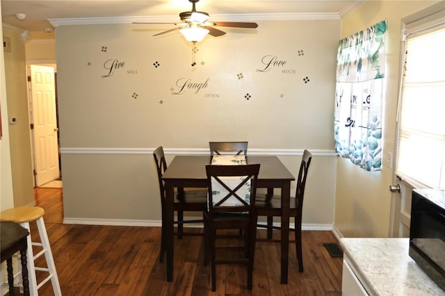 dining area featuring ornamental molding, ceiling fan, and dark wood-type flooring