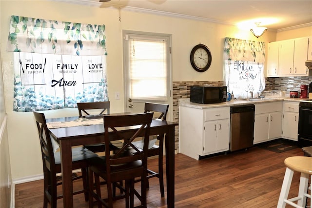 kitchen featuring dishwasher, tasteful backsplash, dark hardwood / wood-style floors, white cabinets, and ornamental molding