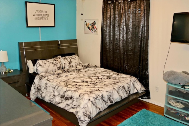 bedroom featuring dark wood-type flooring